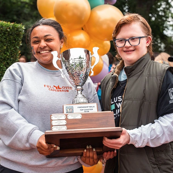 participants holding trophy